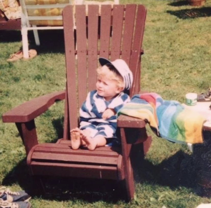 Ontario Environment Minister David Piccini is shown as a child, wrapped in a towel and sitting on a Muskoka chair.