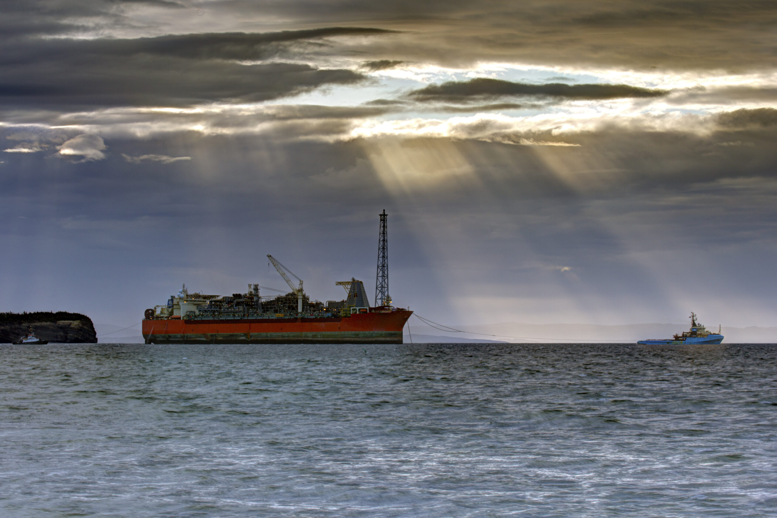 SeaRose FPSO tugged under beam of sunlight