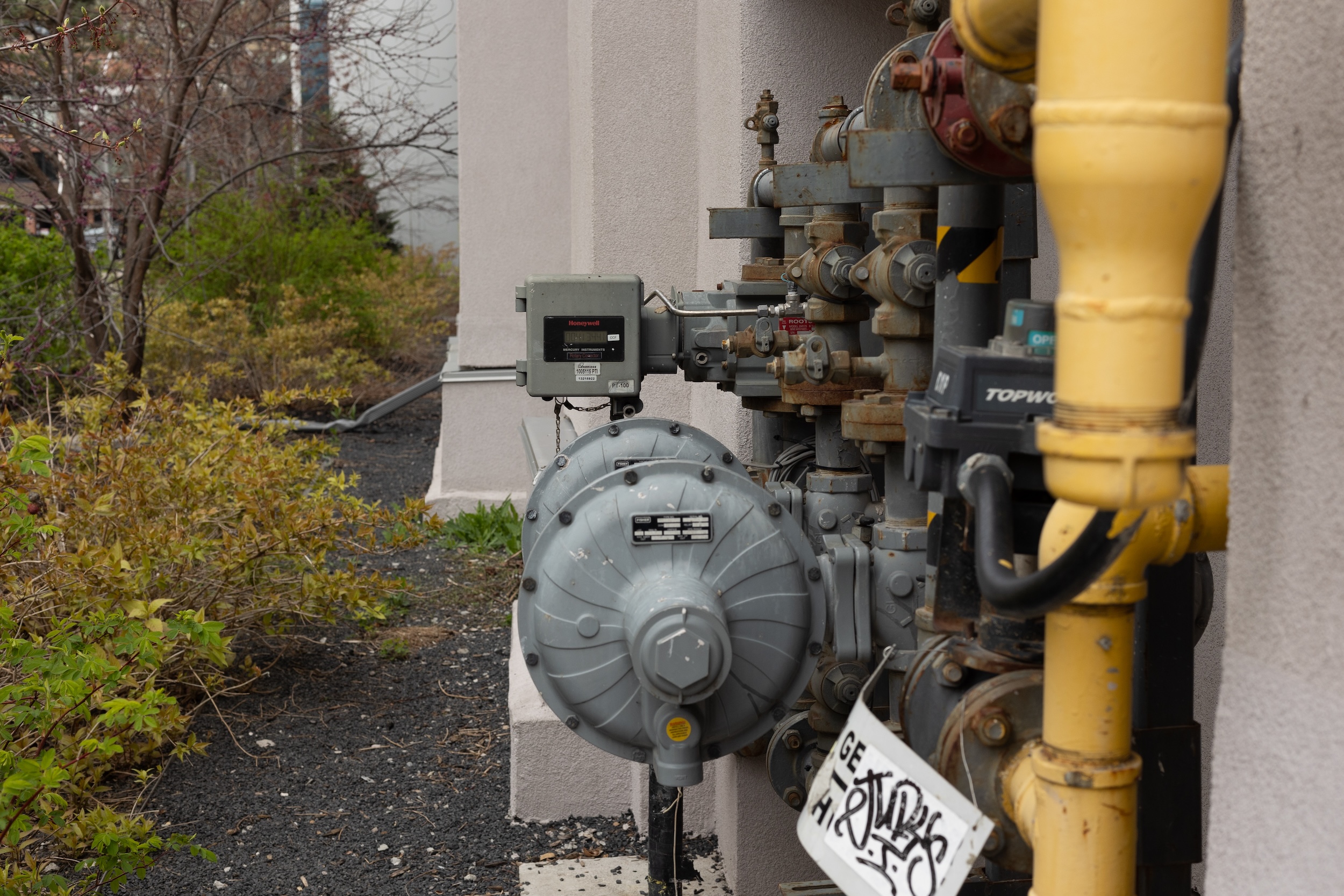 Enbridge gas lines and a metre connected to the outside of a building.