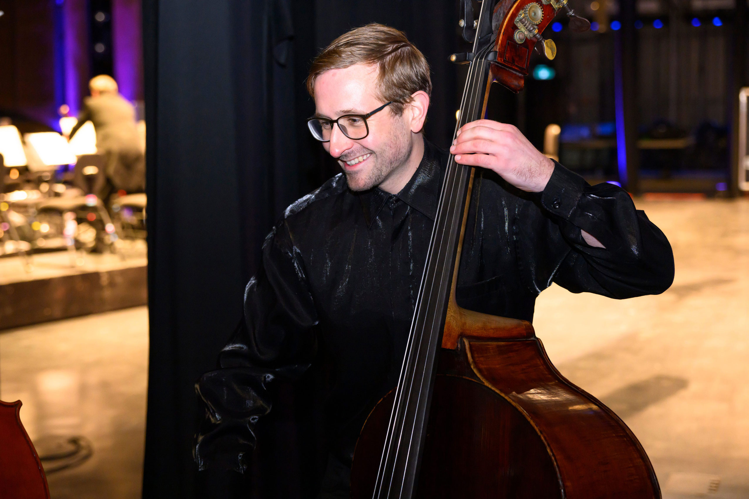 Winnipeg symphony orchestra bassist Daniel Perry smiles while playing